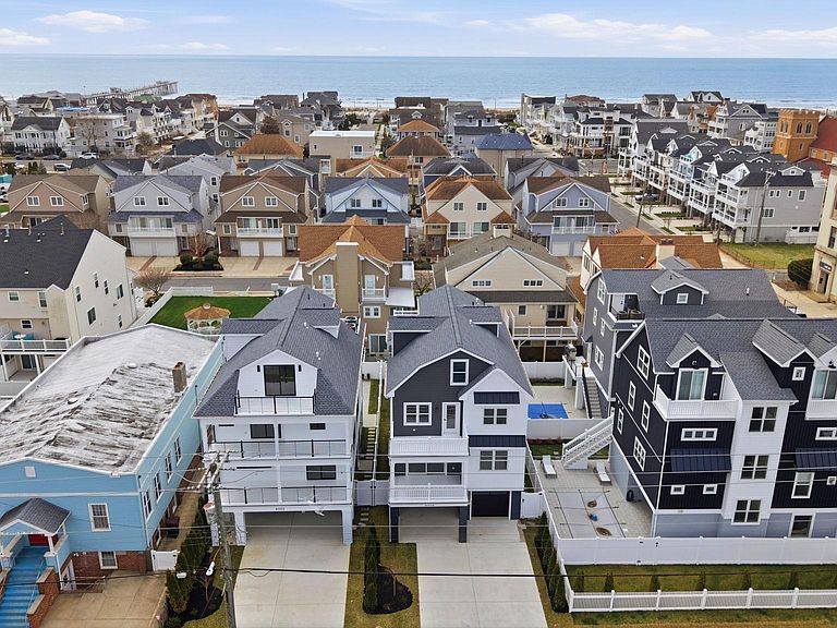 Aerial view of 6302 Ventnor Avenue with the Atlantic Ocean and Ventnor boardwalk visible two blocks behind the house